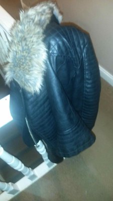 R's leather on the bannister