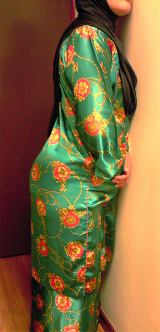 Beauty curve in satin kurung cloth
