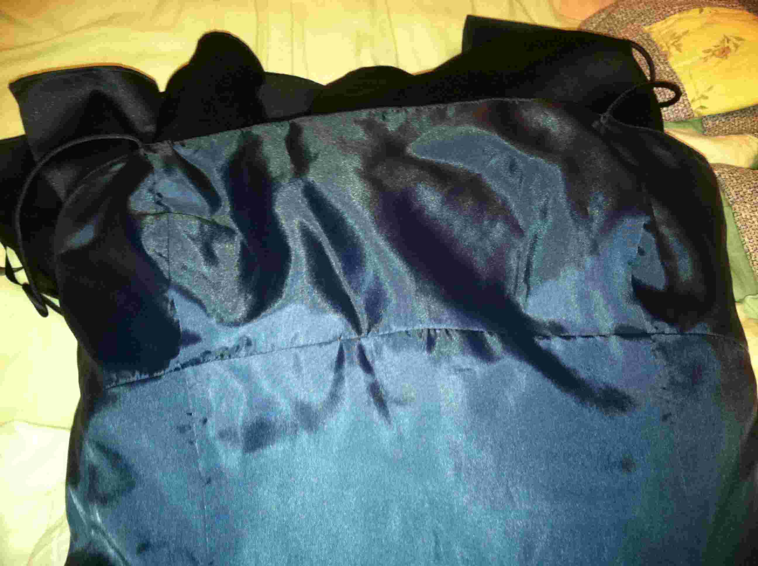 super silky lining, heavy with the sweet scent of it's former owner