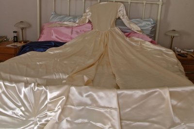 This 1940s slipper satin gown is simply huge, and covers me so completely, I feel I am drowning in a sea of satin