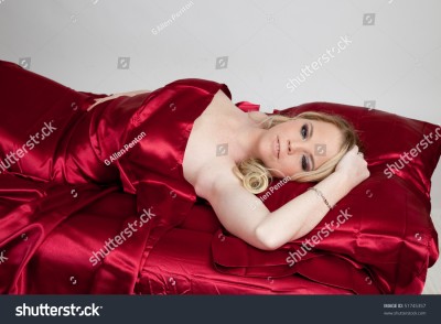 stock-photo-beautiful-blond-woman-in-bed-with-red-satin-sheets-51745357.jpg