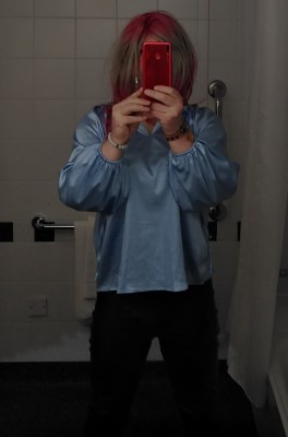 blue satin blouse and black shiny leggings