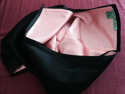 Sexy black satin pencil skirt with silk lining exposed.